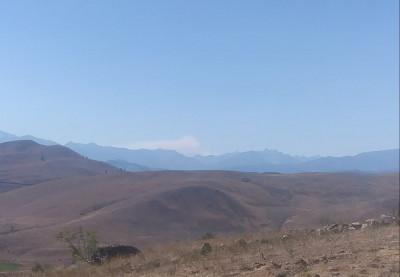 Wind blowing mushroom cloud. Looking over Balky Hill and Reynolds is to the Lookers right in the picture